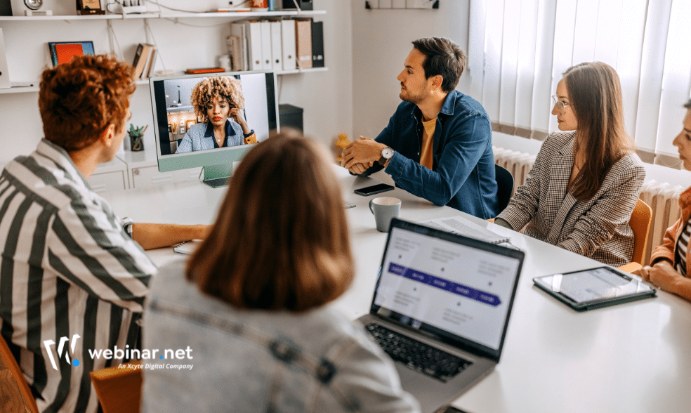 Hybrid event setup with live audience and remote participants connected via streaming platform